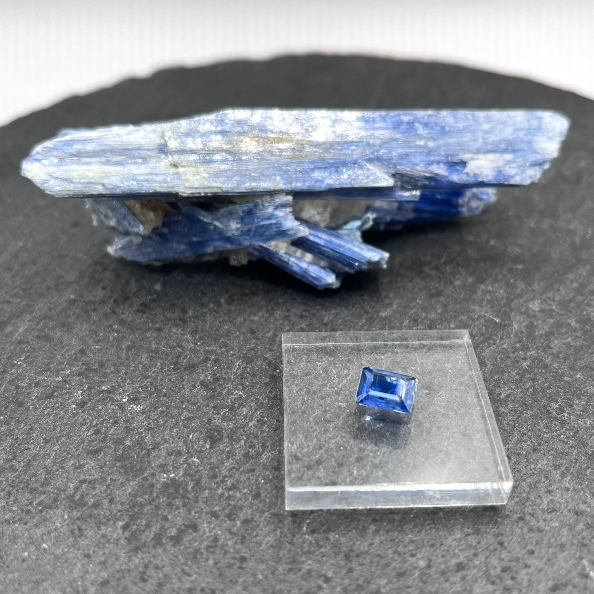 A rough kyanite from Brazil (top) and a faceted kyanite, origin unknown (bottom).